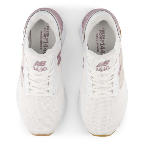 White sneakers with pink accents on a white background