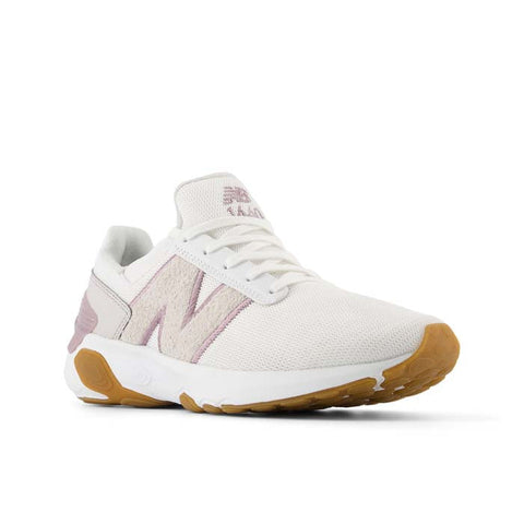 White sneaker with brown sole on a white background