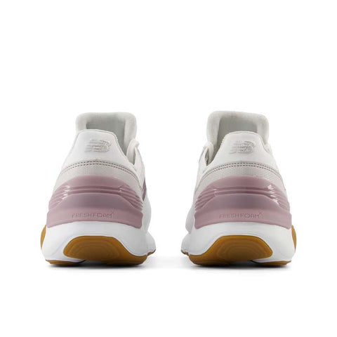 White running shoes with pinkish-purple gradient sole on a white background