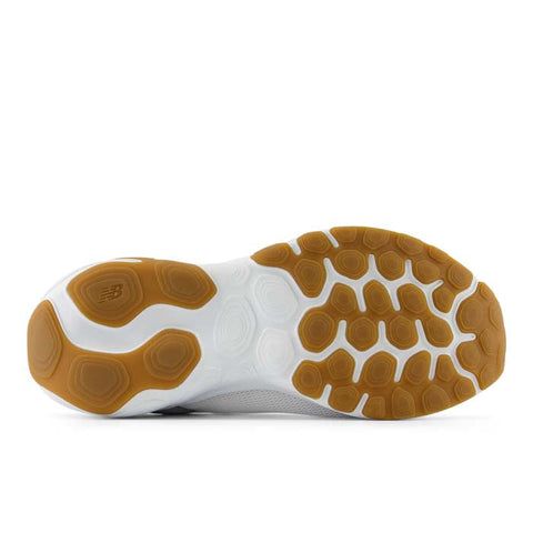 Close-up of a shoe sole with brown tread pattern on a white background