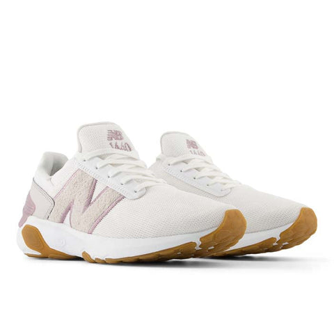 White sneakers with brown soles on a white background