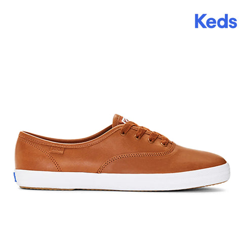 Brown Keds sneaker on a white background