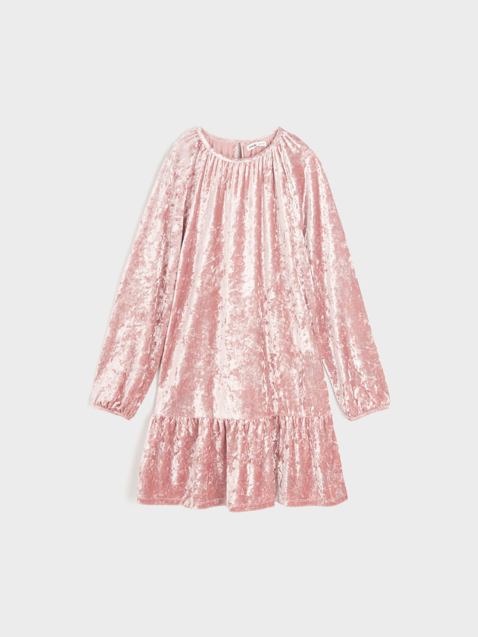 Pink textured dress on a light gray background