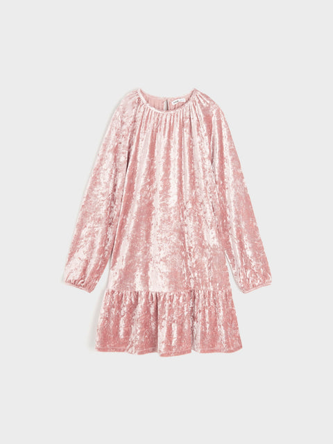 Pink textured dress on a light gray background