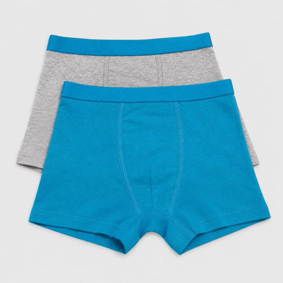 Two pairs of men's boxer briefs stacked on a light gray background. The front pair is bright turquoise blue, and the pair behind it is heather gray with a matching turquoise waistband.