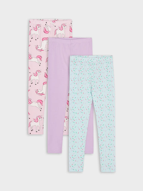Three pairs of children's leggings with different patterns on a white background
