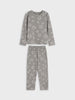 A two-piece children's pajama set in a medium gray color, featuring a long-sleeve top and matching pants with an all-over white star pattern, displayed on a light gray background.