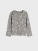 A long-sleeve crewneck top in gray with an all-over white outline star pattern, displayed flat against a light gray background.