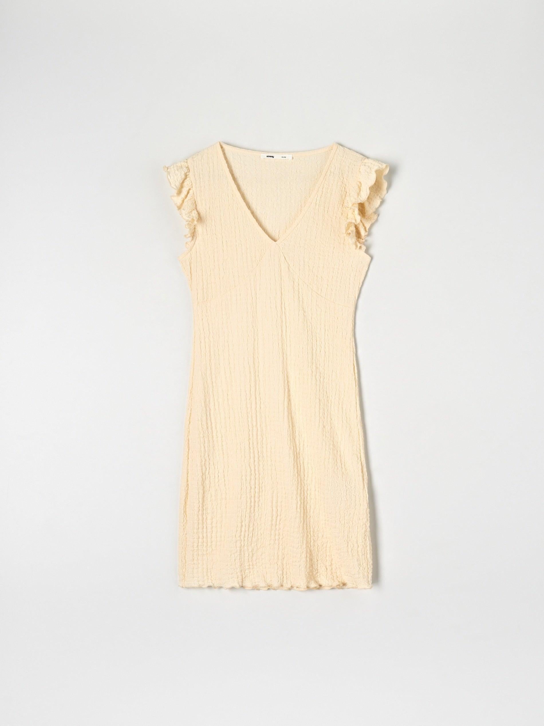 Yellow dress with ruffled sleeves on a white background