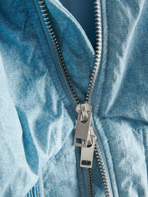 Close-up of a zipper on a denim jacket