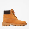 Tan boot with brown top on a white background