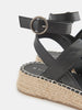 Black wedge sandal with espadrille sole on a white background