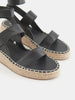 Black sandals with cork sole on a white background