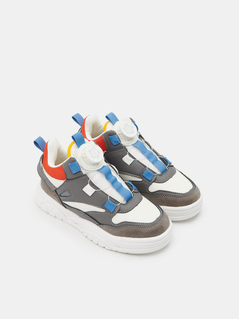 Colorful sneakers with unique laces on a white background