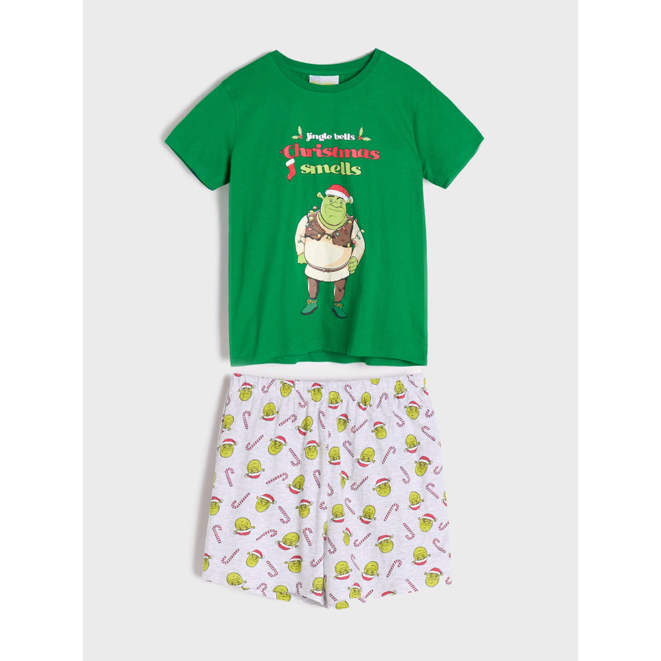A two-piece children's pajama set featuring a green short-sleeve t-shirt with a Shrek 'Jingle with Christmas Sandels' graphic, paired with light pink shorts covered in a green and red candy cane print.