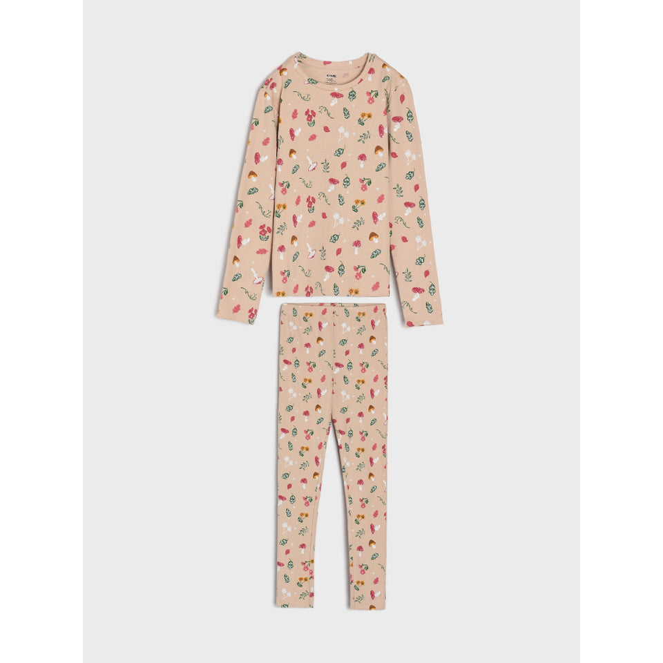 A two-piece children's pajama set featuring a long-sleeve top and matching leggings in a light beige color, decorated with a small all-over print of strawberries, cherries, and leaves.