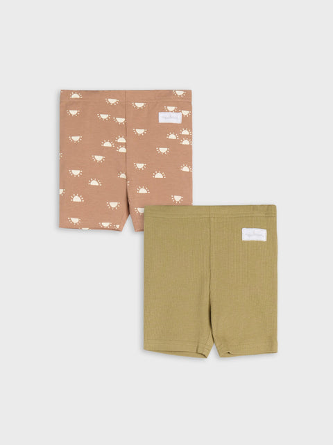 Two pairs of shorts, one with a pattern and one solid color, on a white background.