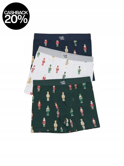 Three pairs of underwear with nutcracker pattern on a white background