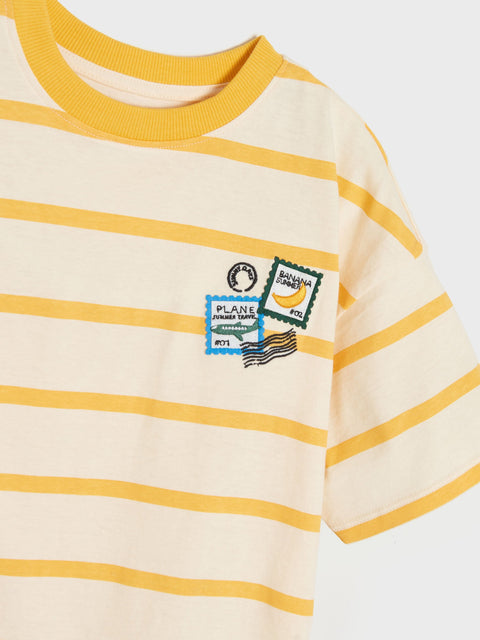 Beige and yellow striped t-shirt with a graphic design on a white background