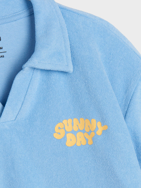 Light blue shirt with 'Sunny Day' text in yellow on a white background