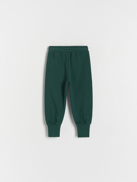 Green sweatpants on a white background