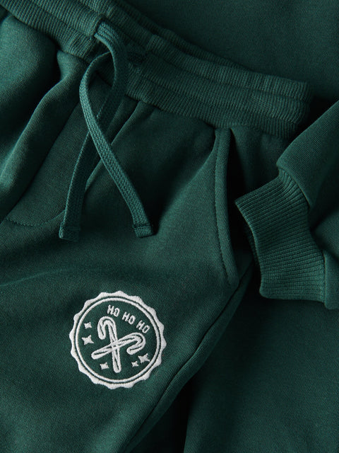 Green sweatshirt with a white logo on a matching green background