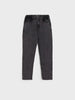Black jeans on a light gray background