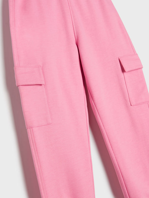 Close-up of pink pants with cargo pockets on a light background
