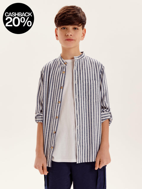 Young boy wearing a striped shirt with a cashback 20% offer on a white background