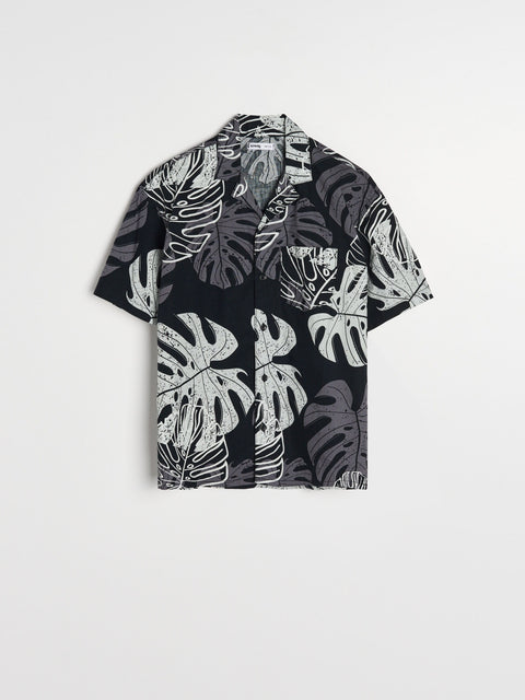 Black shirt with white leaf pattern on a white background
