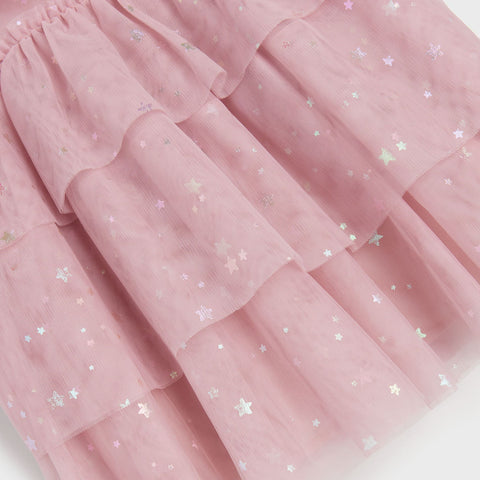 Pink tulle skirt with star patterns on a white background