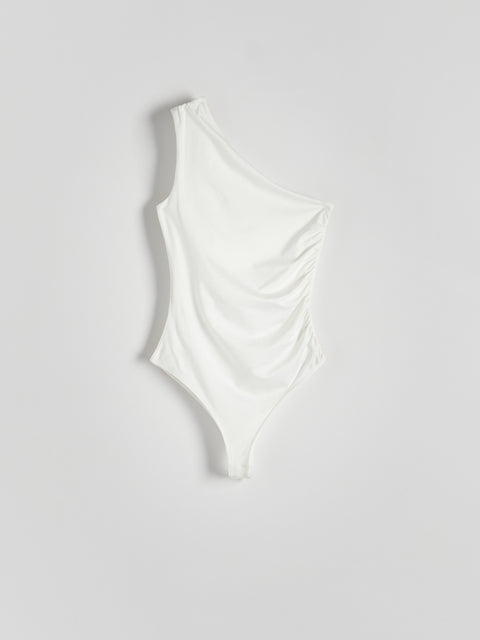 White swimsuit on a light gray background