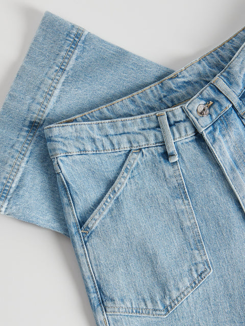 Light blue denim jeans on a white background