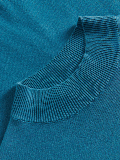 Close-up of a blue sweater collar with a soft texture