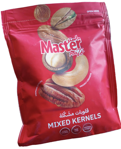 Bag of Master Nuts mixed kernels on a table with books in the background