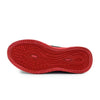 A close-up view of a red athletic shoe sole, showing the textured tread pattern against a plain white background.
