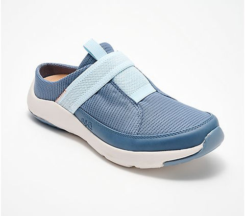 Blue casual shoe with a white sole on a light gray background