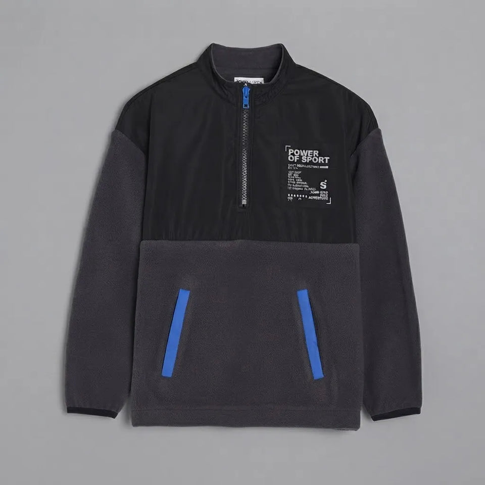 A dark gray and black quarter-zip fleece pullover sweatshirt with a white graphic print on the left chest and bright blue accents on the front pockets, displayed flat against a neutral gray background.