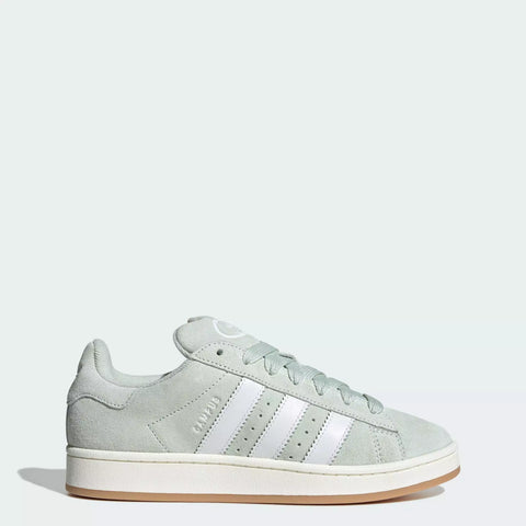 Light gray Adidas sneaker with white stripes on a light gray background