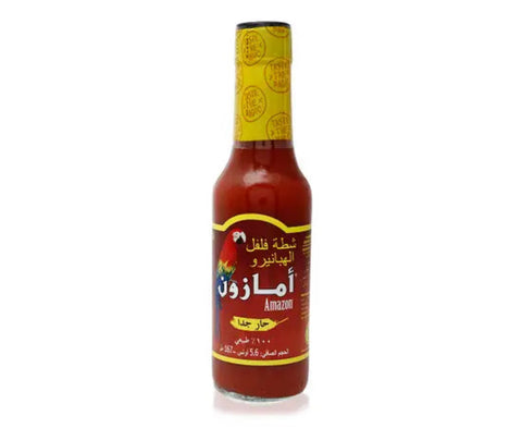 Bottle of Amazon hot sauce with a yellow label on a white background