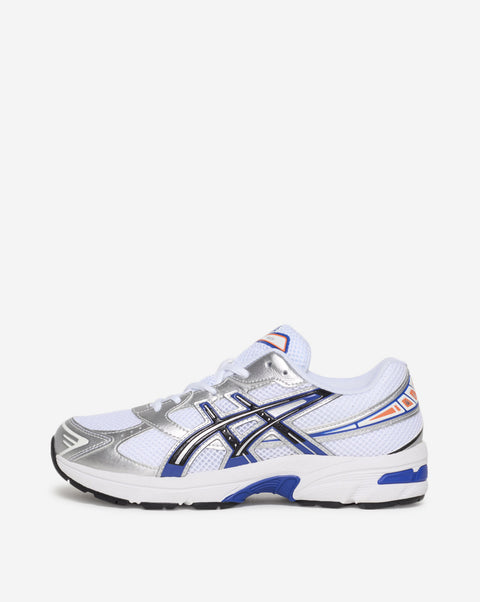White running shoe with blue and black accents on a white background