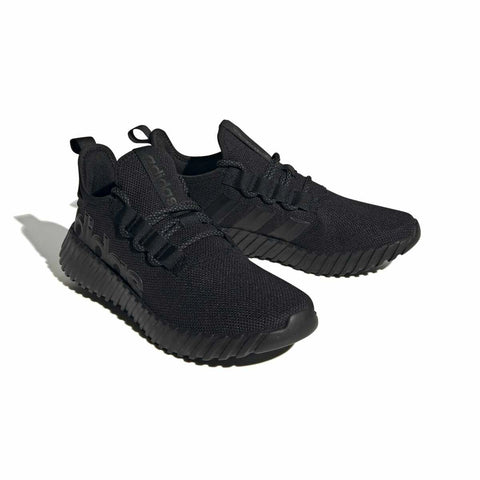 Black Adidas sneakers on a white background