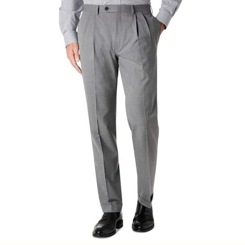 Gray dress pants worn with a checkered shirt and black shoes on a white background