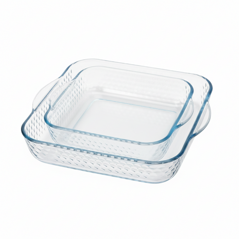 Clear glass baking dish with blue interior on a white background