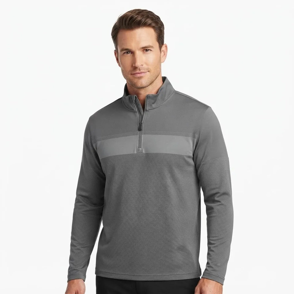 A man wearing a dark gray long-sleeve quarter-zip pullover with a lighter gray horizontal chest stripe, photographed against a clean white background.