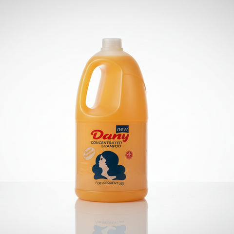 Yellow bottle of Dany Concentrated Shampoo on a concrete surface with a blurred background.