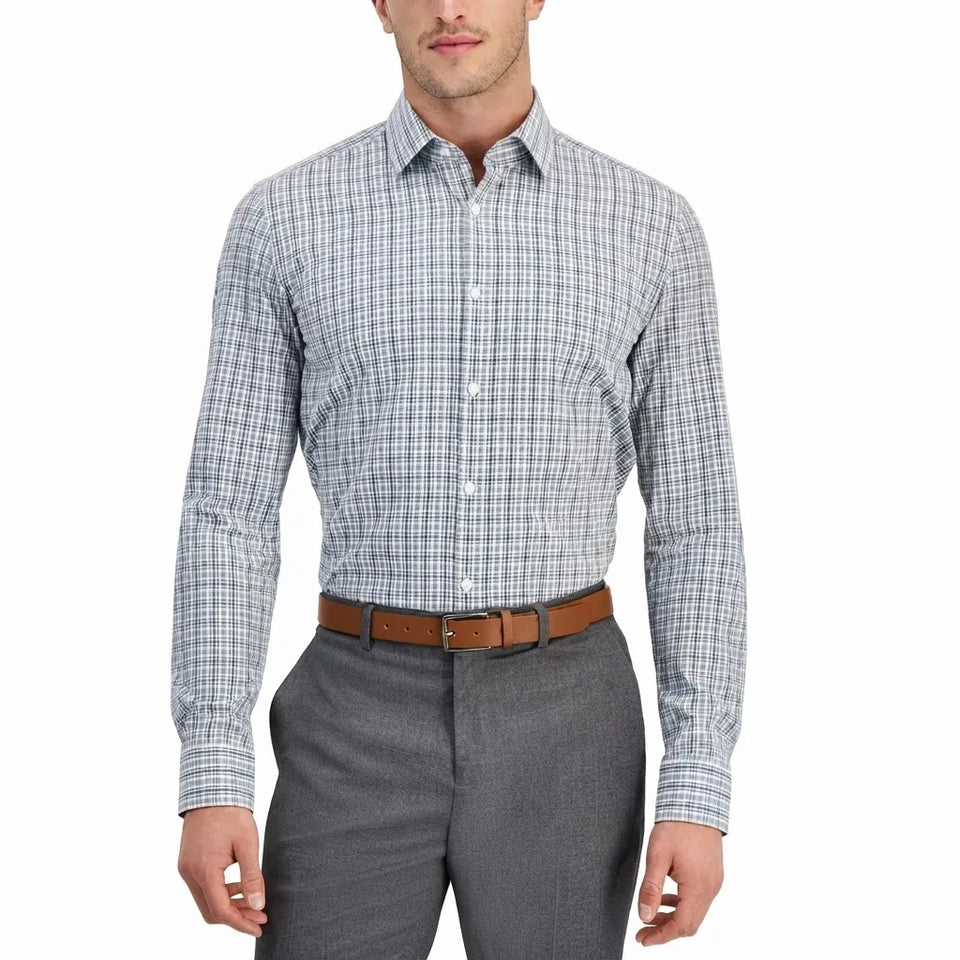 A man wearing a long-sleeve button-down dress shirt with a fine blue and white checkered pattern, paired with gray trousers and a brown leather belt, shown against a plain white background.