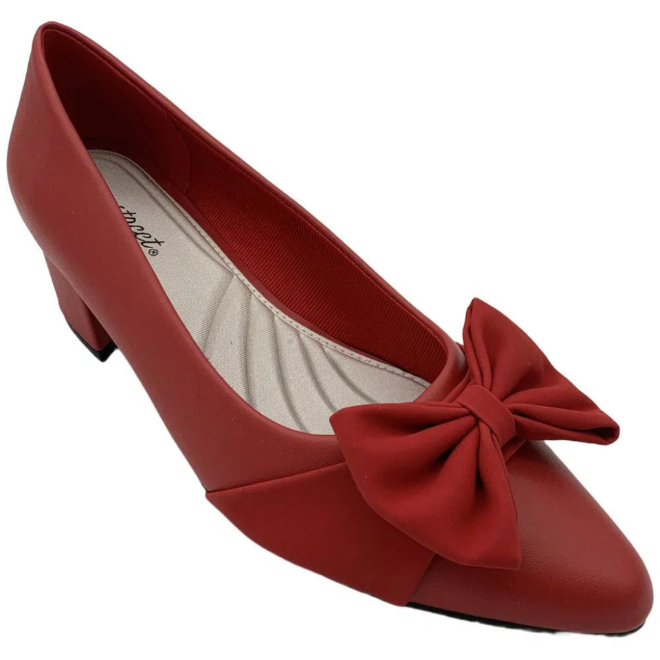 A red leather pointed-toe pump with a low block heel and a matching fabric bow on the toe box, shown against a plain white background.