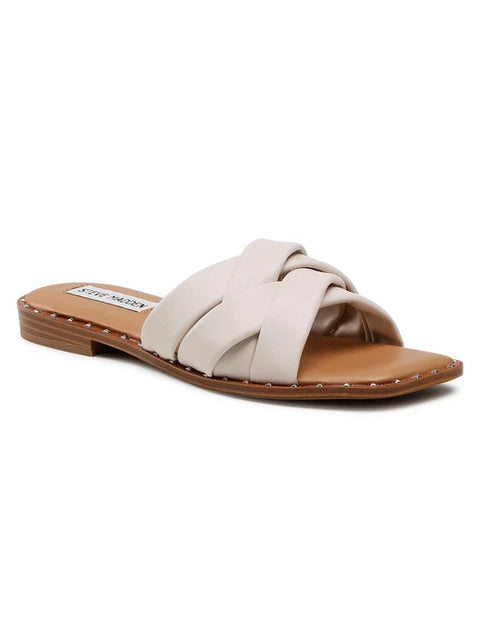 Beige sandal with a brown sole on a white background