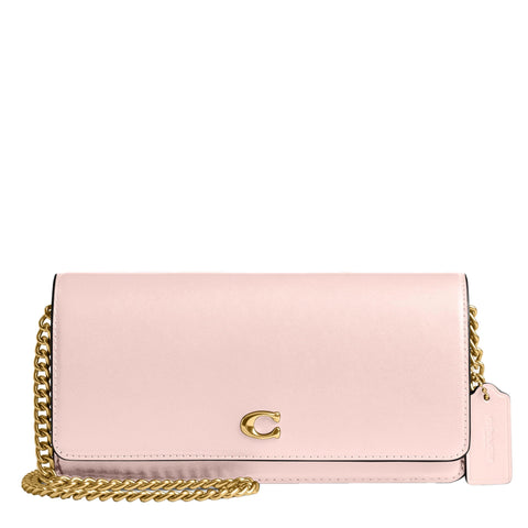 Pink handbag with gold chain on a white background